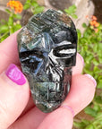 Green Tourmaline Palm Skull by Igor de Souza