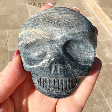 Blue Richterite Palm Crystal Skull Carved by Leandro de Souza