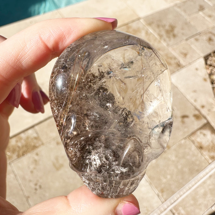 Golden Rutile and Lodolite Quartz Palm Crystal Skull Carved by Leandro de Souza