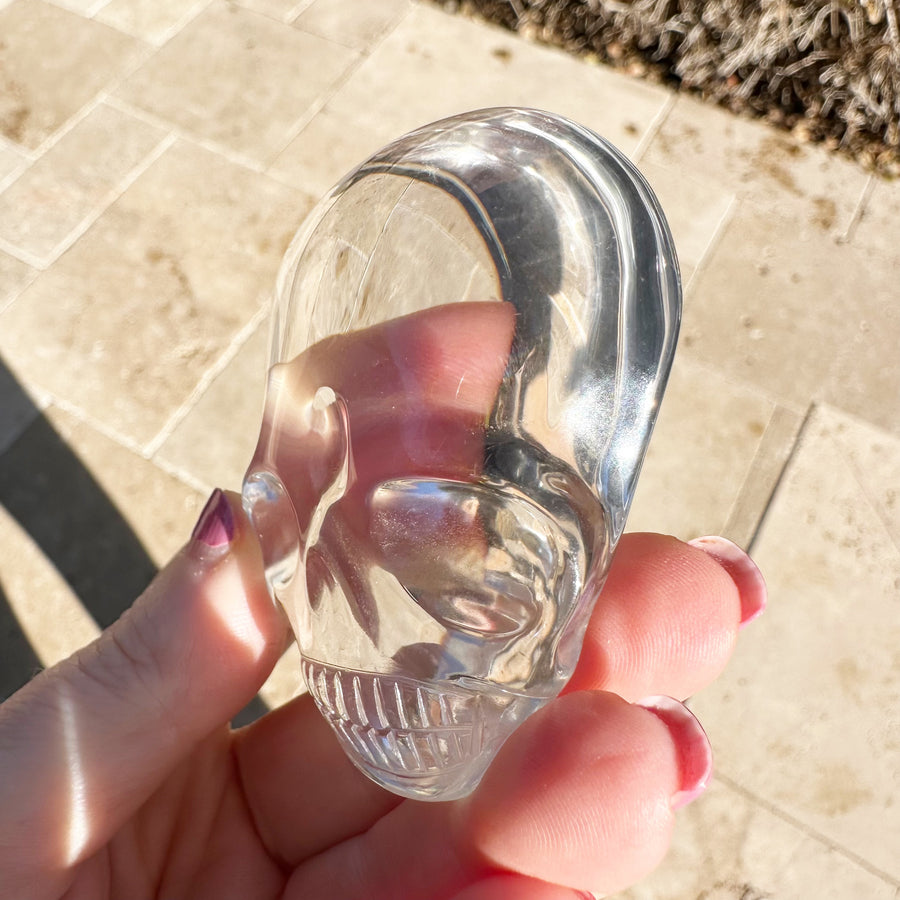 Ultra Clear Lemurian Quartz Palm Crystal Skull Carved by Leandro de Souza