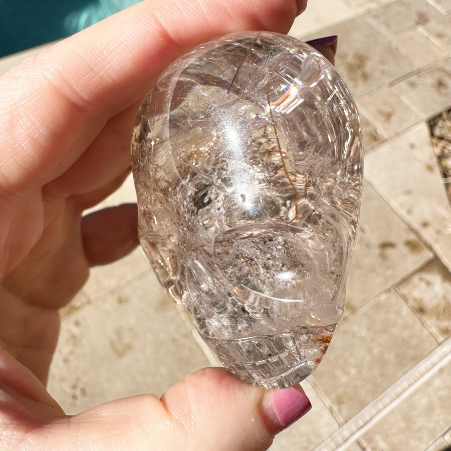 Golden Rutile and Lodolite Quartz Palm Crystal Skull Carved by Leandro de Souza