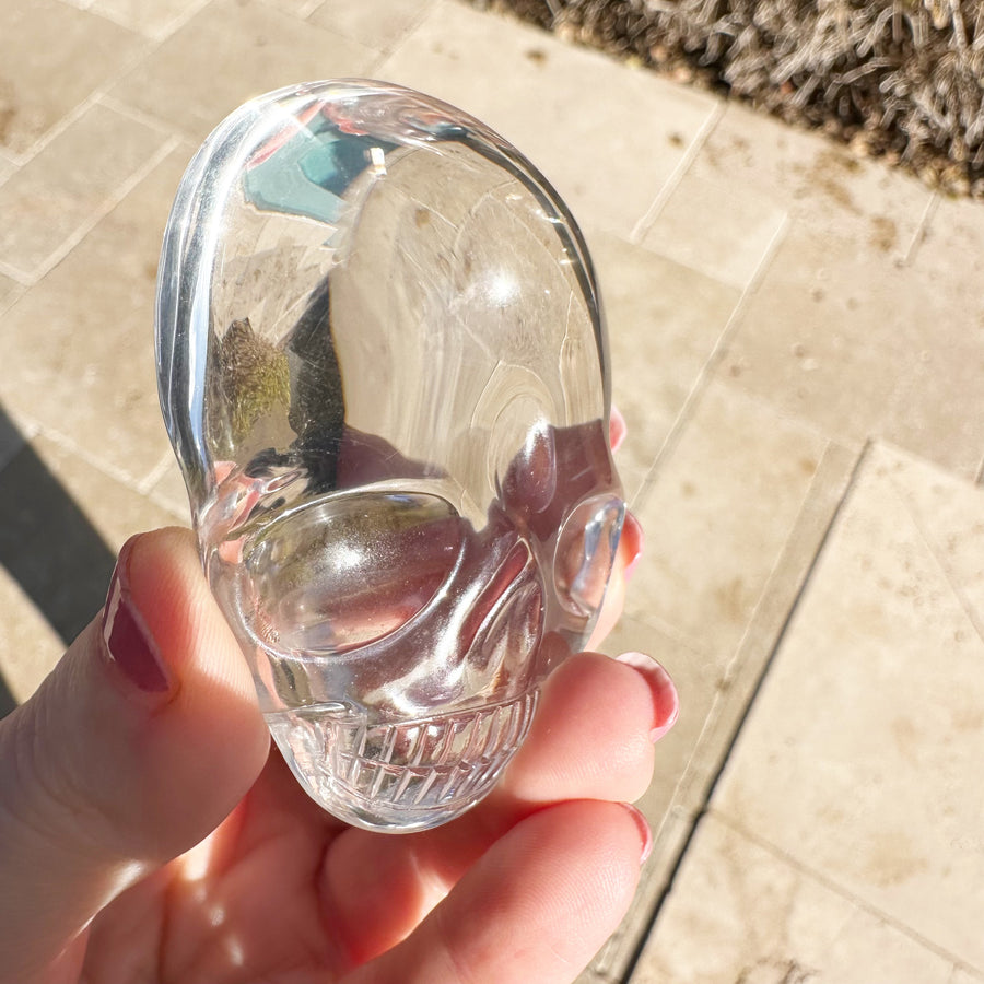 Ultra Clear Lemurian Quartz Palm Crystal Skull Carved by Leandro de Souza