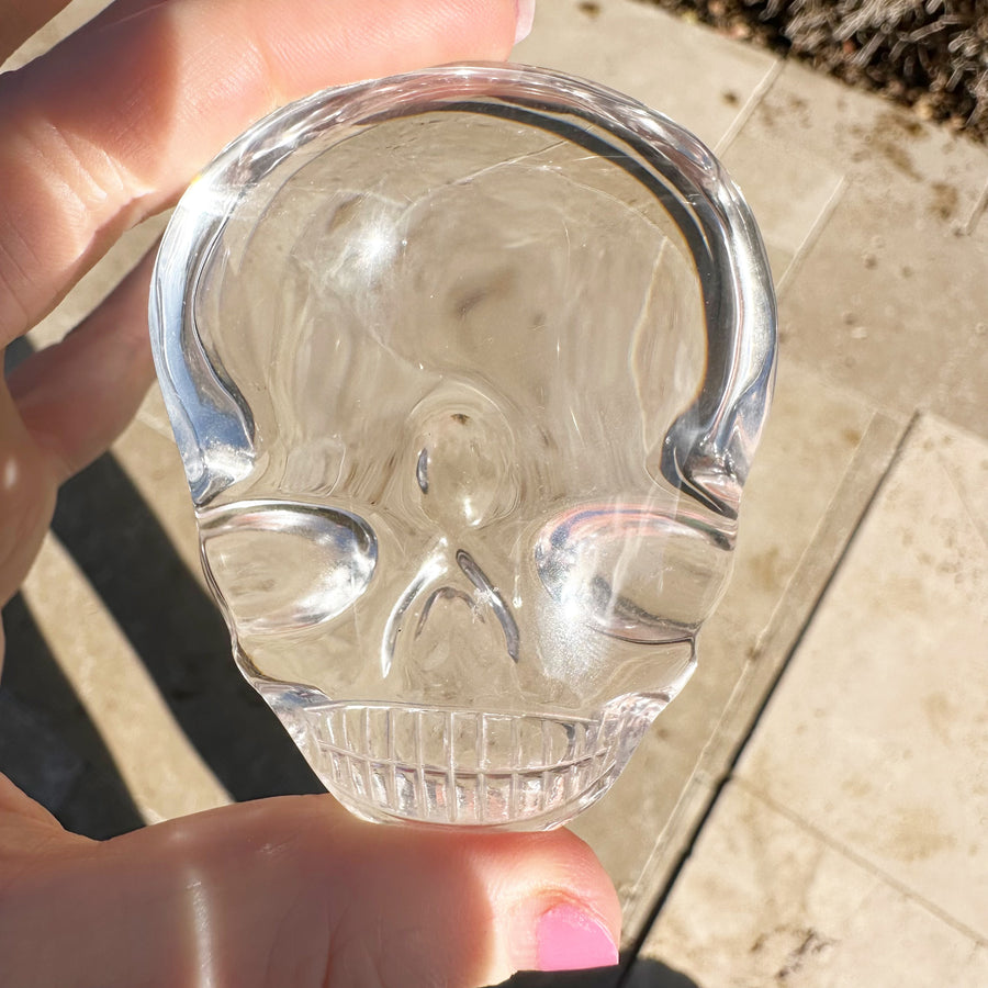 Ultra Clear Lemurian Quartz Palm Crystal Skull Carved by Leandro de Souza