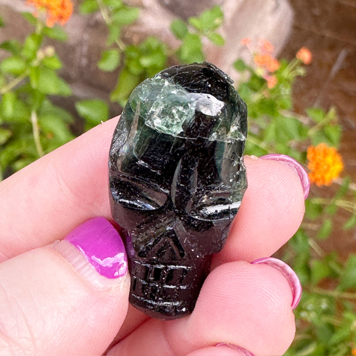 Green Tourmaline Palm Skull by Igor de Souza