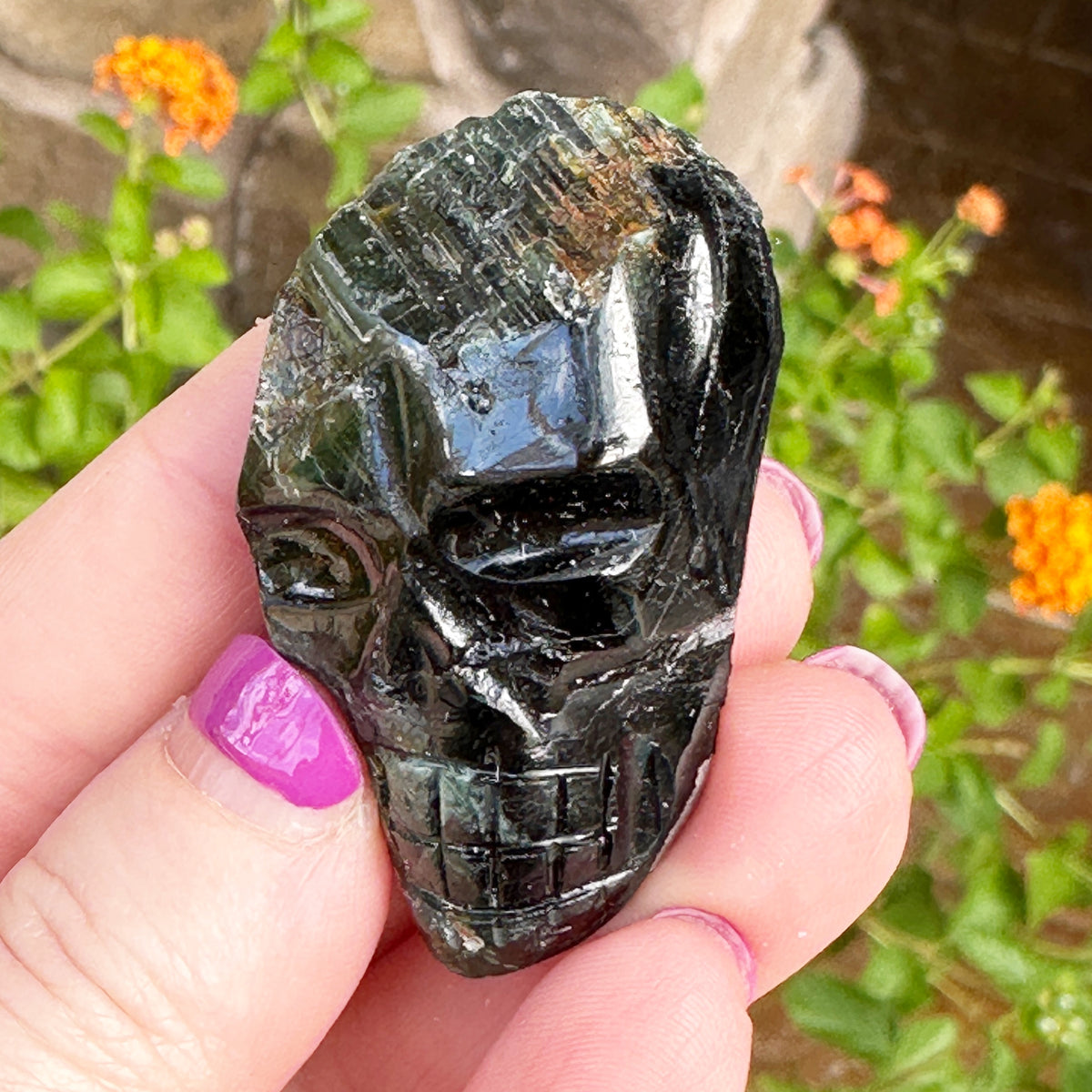 Green Tourmaline Palm Skull by Igor de Souza