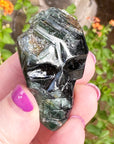 Green Tourmaline Palm Skull by Igor de Souza