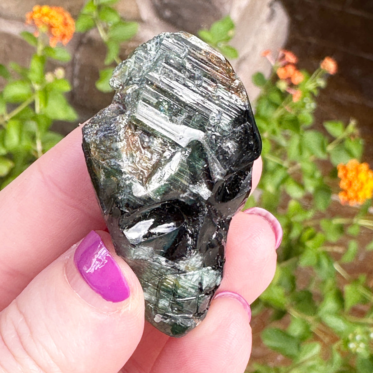 Green Tourmaline Palm Skull by Igor de Souza