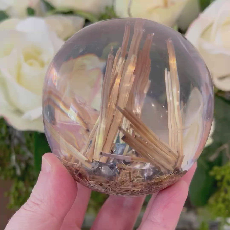 Golden Rutile set in Polished Resin Sphere