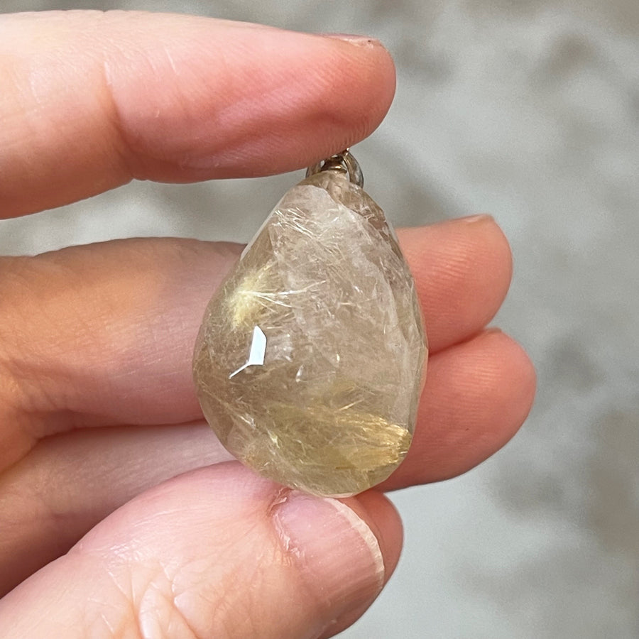 Faceted Golden Rutile in Quartz Crystal Pendant