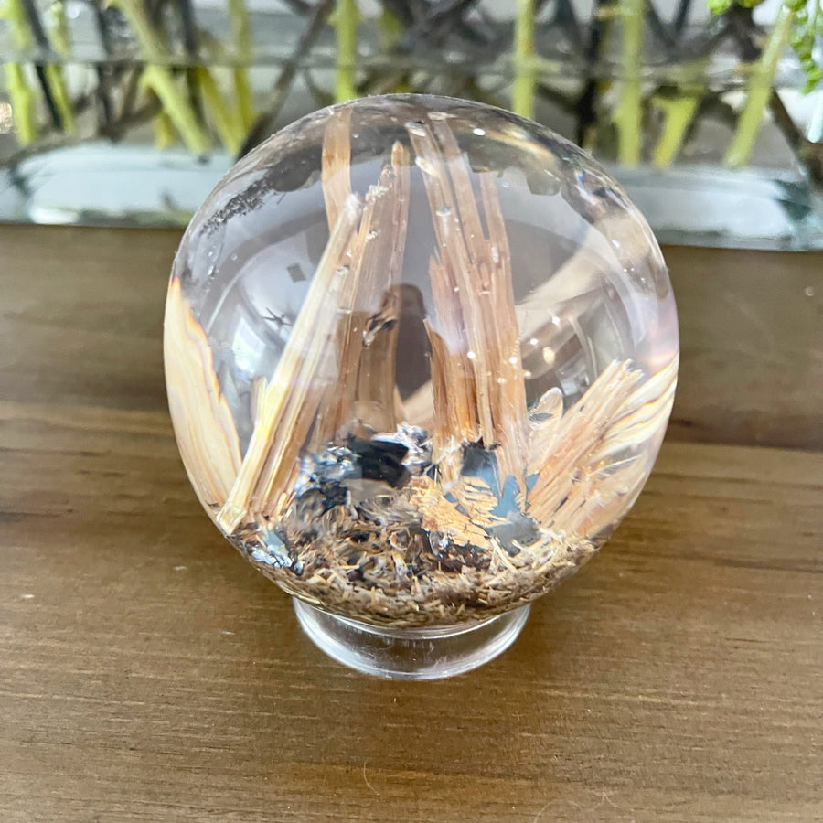 Golden Rutile set in Polished Resin Sphere