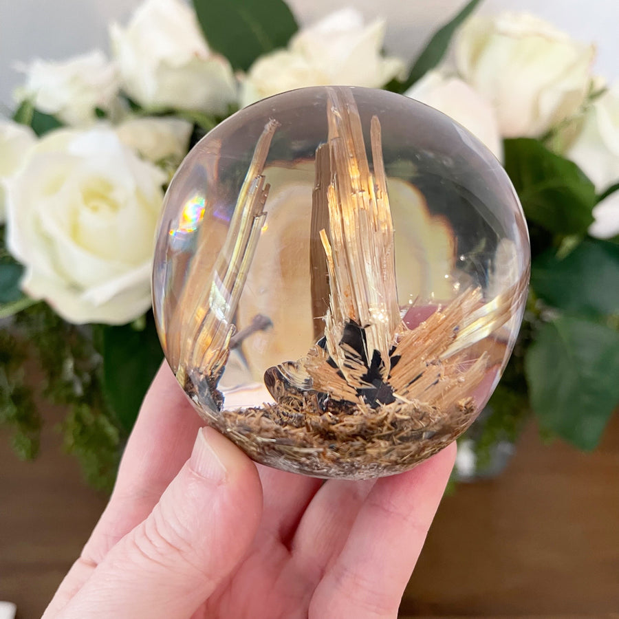 Golden Rutile set in Polished Resin Sphere