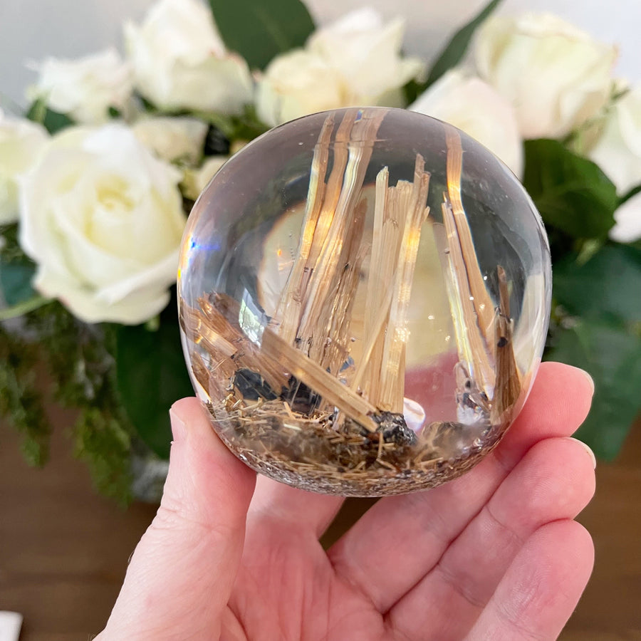 Golden Rutile set in Polished Resin Sphere