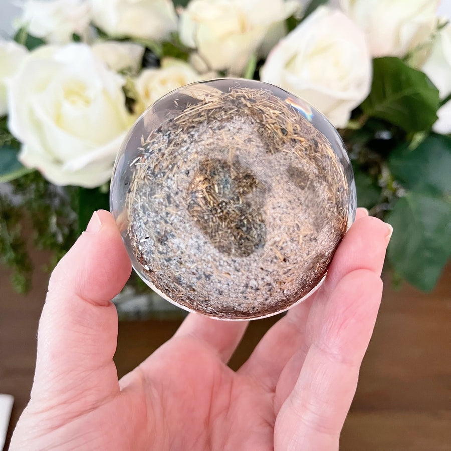 Golden Rutile set in Polished Resin Sphere