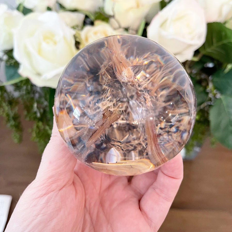 Golden Rutile set in Polished Resin Sphere